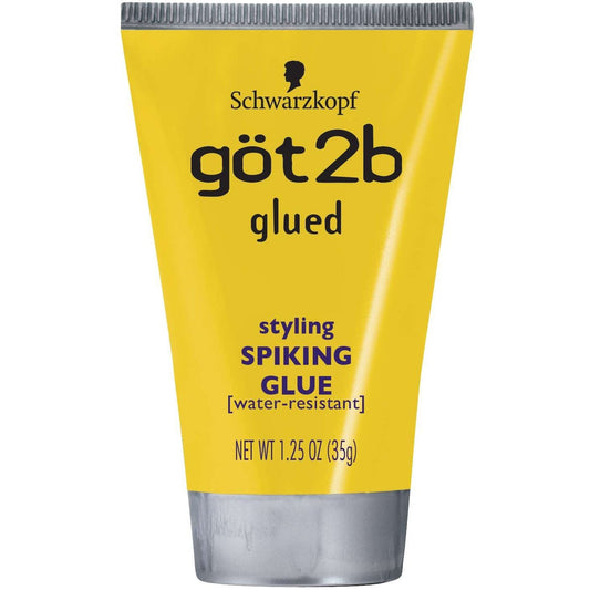 Yellow Schwarzkopf got2b glued spiking glue, 1.25 oz water-resistant hair gel tube with silver cap.